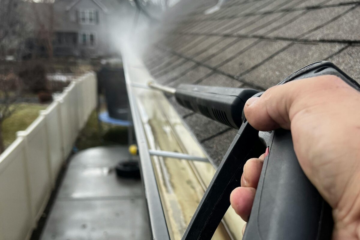 Gutter cleaning maintenance in action