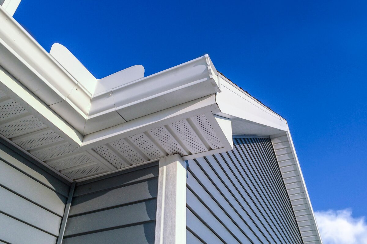 White K-style gutter detail with downspout