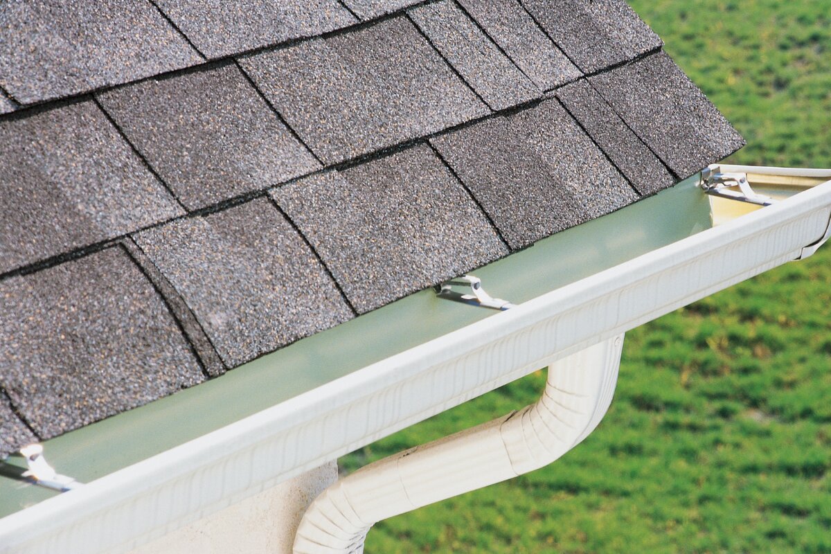 Cream gutter with downspout detail